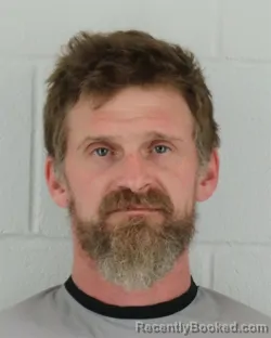 Mugshot of JOHN HENRY SCHMIDT booked in Johnson County, Kansas on March 18, 2026