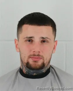 Mugshot of JORDAN DAVID BASS booked in Johnson County, Kansas on March 20, 2026