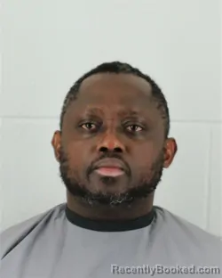 Mugshot of THIERRY FEUJIO AGUEGUIA booked in Johnson County, Kansas on March 20, 2026