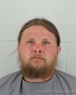 Mugshot of AARON MICHAEL HENSHAW booked in Johnson County, Kansas on March 21, 2026