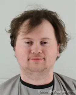 Mugshot of TREVOR THOMAS NEWELL booked in Johnson County, Kansas on March 22, 2026