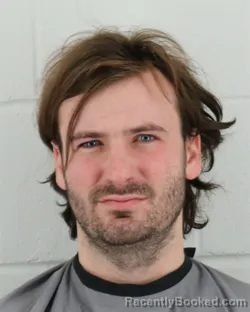 Mugshot of QUINN LIONEL MICHAUD booked in Johnson County, Kansas on March 23, 2026