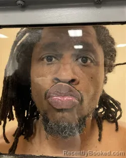 Mugshot of PATRICK MUGAMBI MUREITHI booked in Johnson County, Kansas on March 23, 2026