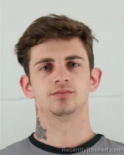 Mugshot of AUSTIN TYLOR MOORE booked in Johnson County, Kansas on March 27, 2026