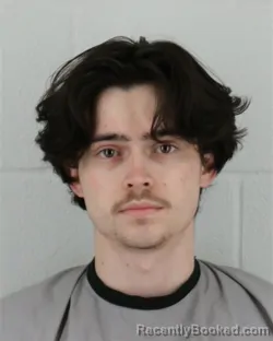 Mugshot of QUINN RICHARD DELGADO booked in Johnson County, Kansas on March 27, 2026