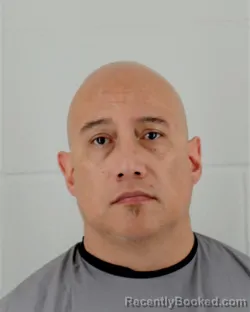 Mugshot of ANGEL ANTONIO RIZO booked in Johnson County, Kansas on April 1, 2026