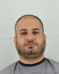 Mugshot of MAJID AREFIDOUST booked in Johnson County, Kansas on April 1, 2026