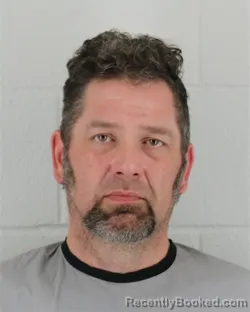 Mugshot of ADAM JOHN LUSSIER booked in Johnson County, Kansas on April 1, 2026