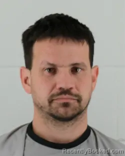 Mugshot of CHARLES RUSSELL WISMER booked in Johnson County, Kansas on April 4, 2026