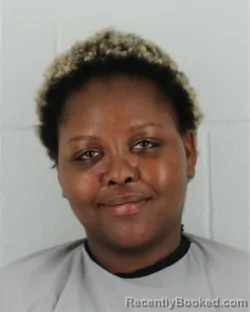 Mugshot of CAROLINE WANJIRU GUCHU booked in Johnson County, Kansas on May 5, 2026