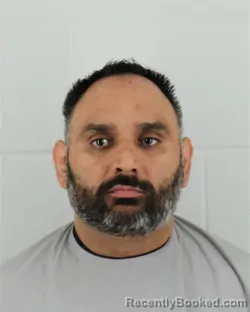Mugshot of LOVENEET SINGH booked in Johnson County, Kansas on May 18, 2026