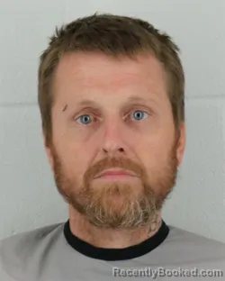 Mugshot of JOSHUA DAVID GILE booked in Johnson County, Kansas on May 19, 2026