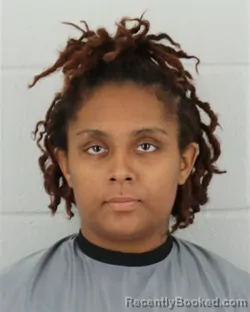 Mugshot of BREANNA JASHA REED booked in Johnson County, Kansas on May 24, 2026