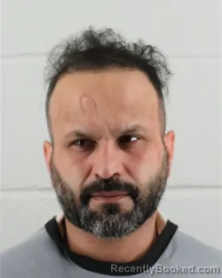Mugshot of FARDIN ABDUL RAHIM FAZLI booked in Johnson County, Kansas on July 7, 2026