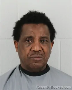 Mugshot of DANIEL MAGURU MWANGI booked in Johnson County, Kansas on July 9, 2026