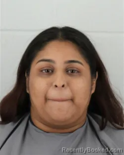 Mugshot of Diana Laura Salgado-Delfin booked in Johnson County, Kansas on August 21, 2026