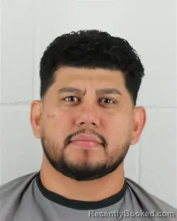 Mugshot of Carlos Renan Cevallos-Mendez booked in Johnson County, Kansas on August 23, 2026