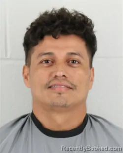 Mugshot of Carlos Roberto Garcia-Hernandez booked in Johnson County, Kansas on August 30, 2026