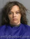 Mugshot of KATHRYN MARIE CARPENTER booked in Leavenworth County, Kansas on April 8, 2026