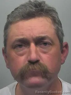 Mugshot of Erik Wesley Burk booked in McPherson County, Kansas on March 31, 2026