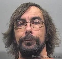 Mugshot of Travis James Koons booked in McPherson County, Kansas on April 25, 2026