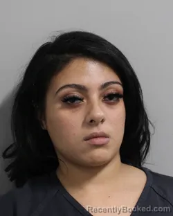 Mugshot of TAINA REYES booked in Polk County, Florida on March 12, 2026