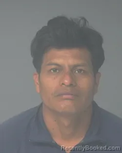 Mugshot of CARLOS EUGENIO JIMINEZ MARTIN booked in Santa Rosa County, Florida on July 9, 2026