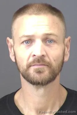 Mugshot of Travis Scott Nelson booked in Saline County, Kansas on March 6, 2026