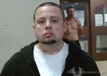 Mugshot of IAN MATTHEW EVANS booked in Sedgwick County, Kansas on March 19, 2026