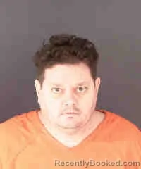 Mugshot of WARNER KENNEY STRINGFELLOW