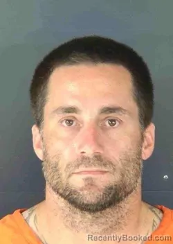 Mugshot of JUSTIN MICHAEL LYONS