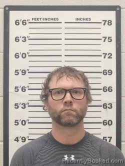 Mugshot of Jason Gerard Ostmeyer booked in Thomas County, Kansas on April 1, 2026