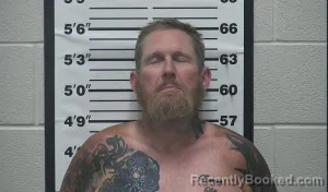 Mugshot of John William Dixon booked in Thomas County, Kansas on July 28, 2026