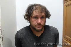 Mugshot of JORDON ALAN STOUT booked in Woodson County, Kansas on July 3, 2026