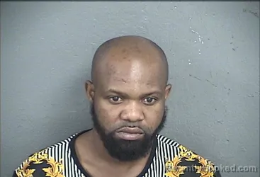 Mugshot of FAUSTIN TUHANGYE WANGETA booked in Wyandotte County, Kansas on May 12, 2026