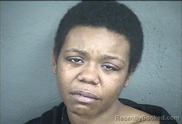 Mugshot of Italia Darzernae Cunningham booked in Wyandotte County, Kansas on August 13, 2026