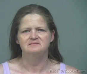 Mugshot of TINA LOUISE TRAVIS booked in Athens County, Ohio on April 13, 2026