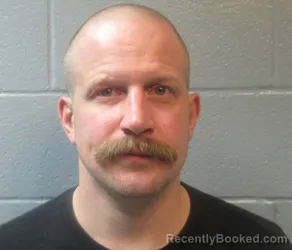 Mugshot of CLARENCE COLBY NUHFER