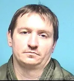 Mugshot of JUSTIN MOORE