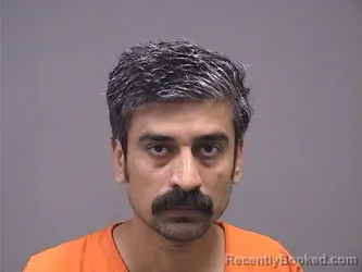 Mugshot of ALI HASSAN booked in Mahoning County, Ohio on July 6, 2026