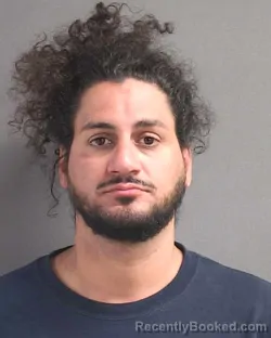 Mugshot of AARON MICHAEL ROSARIO booked in Volusia County, Florida on May 10, 2026