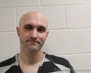 Mugshot of JUSTIN LYNN REYNOLDS