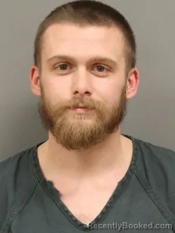 Mugshot of JUSTIN LEE REIER