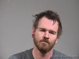 Mugshot of TRAVIS MILES LUPTON