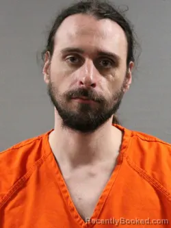 Mugshot of LOGAN MICHAEL ADAMS booked in Tuscarawas County, Ohio on May 18, 2026