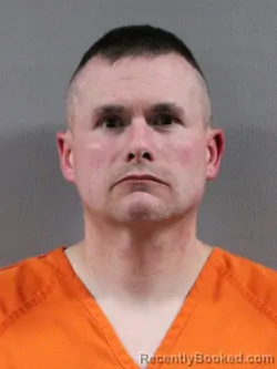 Mugshot of TRAVIS DEAN ROLAND booked in Tuscarawas County, Ohio on May 21, 2026