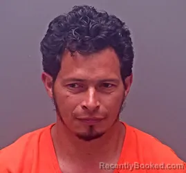 Mugshot of IVIS ORLANDO SARAVIA-MARTINEZ booked in Baldwin County, Alabama on March 6, 2026