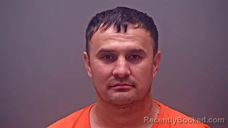 Mugshot of FARRUKH ISLOMOV booked in Baldwin County, Alabama on March 23, 2026