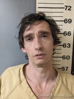 Mugshot of MELVIN JUSTIN-THOMAS SCROGGINS