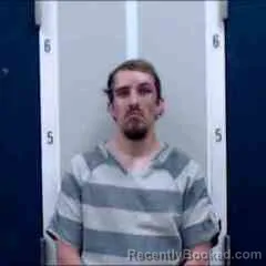 Mugshot of JONATHAN COLE BAKER booked in DeKalb County, Alabama on April 1, 2026